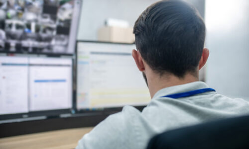 Work,Day.,Dark-haired,Man,In,Gray,Tshirt,Sitting,With,His